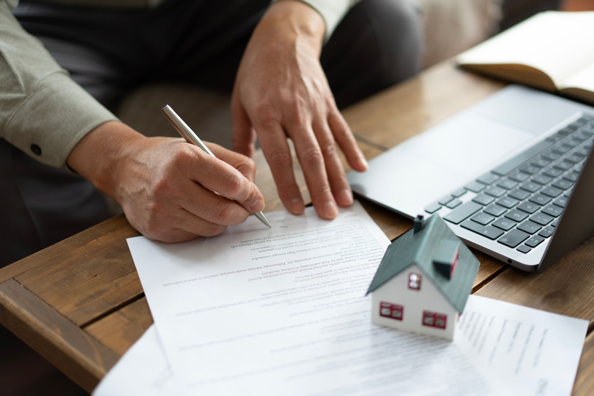 Real estate agent signing a contract for a new house purchase